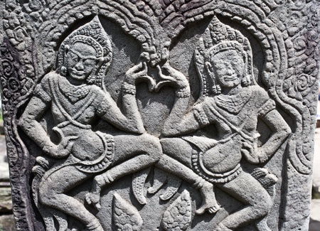 Apsara dancers carved on the wall of Bayon Temple, Angkor area, Cambodia, Southeast Asiaの写真素材
