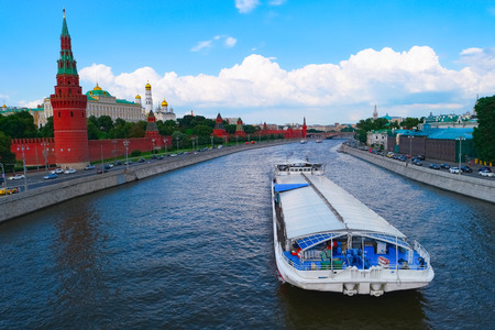View of Moscow Kremlin and big barge on river, Russiaの写真素材