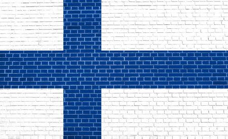 Flag of Finland on brick wall texture background. Finnish national flag.の写真素材