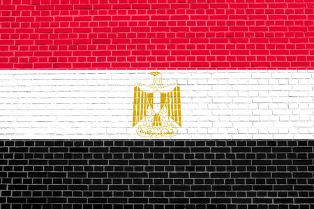 Egyptian national official flag. Arab Republic of Egypt patriotic symbol, banner, element, background. Flag of Egypt on brick wall texture backgroundの写真素材