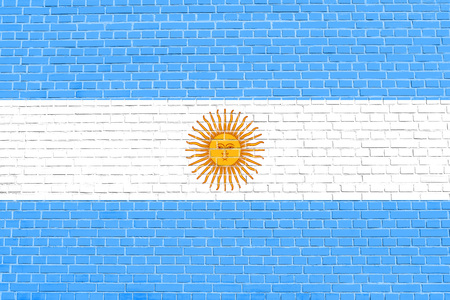 Argentinian national official flag. Argentine Republic patriotic symbol, banner, element, background. Flag of Argentina on brick wall texture backgroundの写真素材