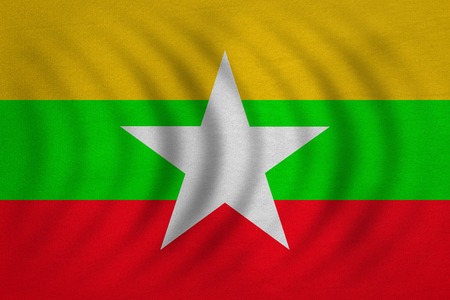 Myanmar national official flag. Patriotic symbol, banner, element, background. Correct colors. Flag of Myanmar wavy with real detailed fabric texture, accurate size, illustrationの写真素材