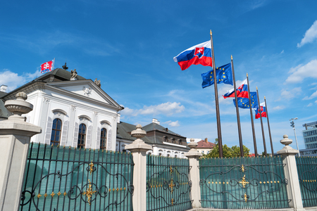 Grassalkovich Palace, Bratislava, Europe. Residence of the president of Slovakia in Bratislava. Grassalkovich Presidential Palace. Slovakian and EU flags. National flags of Slovakia and European Unionのeditorial素材