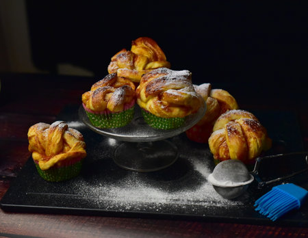 Coffee croissants with whipped cream on a black backgroundの写真素材