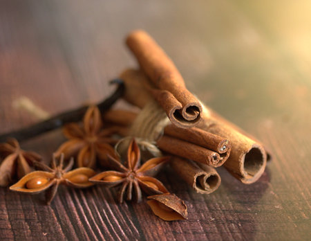 Cinnamon sticks and star anise on wooden table, shallow focusの写真素材