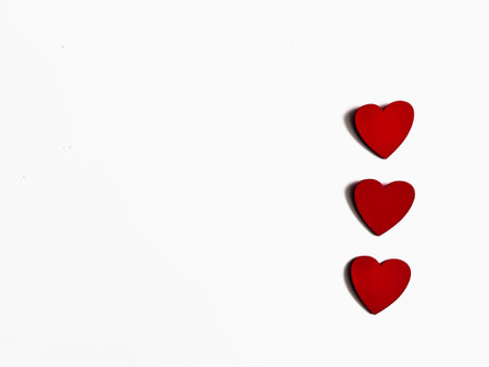 Red hearts on a white background with space for text. Valentine's Dayの写真素材