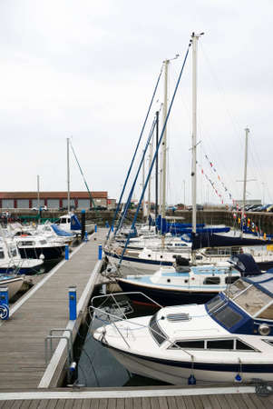 a vertical  image of yachts tied up at jettyの写真素材