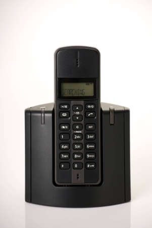 a vertical image of a modern digital cordless phone with searching flashing on displayの写真素材