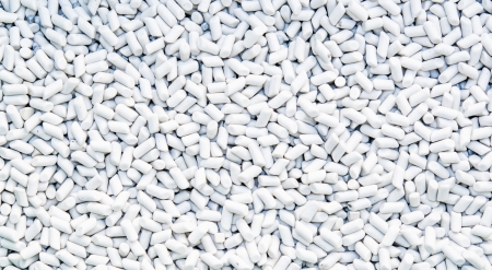 white cylinder stones on background