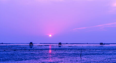 Cottage located in the sea  The accommodation of the fishermen  Beautiful seascape when the sunsetの写真素材