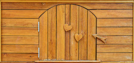 wood door and wood heart for backgroundの写真素材