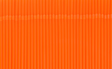 texture of orange drink straws for backgroundの写真素材
