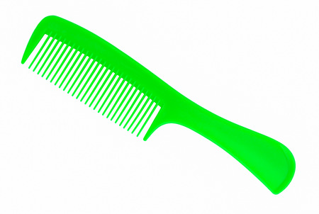 green hair comb isolated on white backgroundの写真素材
