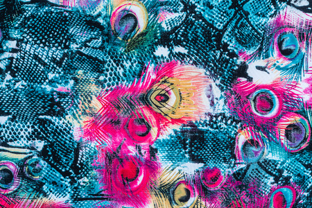 texture of print fabric striped peacock feather and snake for background
