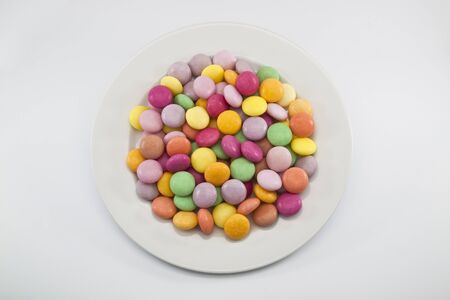 mix color sweet candy on white dish fullの写真素材