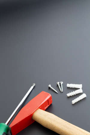 various repair tools on black background