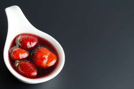 jam in bowl on black background, strawberry jamの写真素材