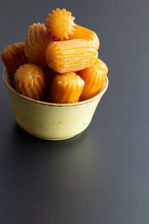Tulumba dessert on a black background, turkish dessert