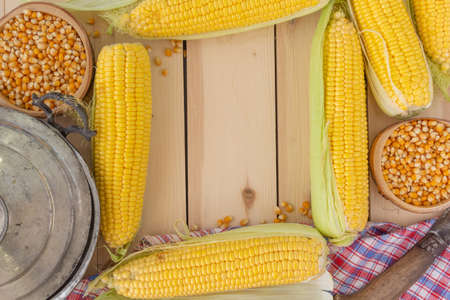 CORN ON WOOD BACKGROUND