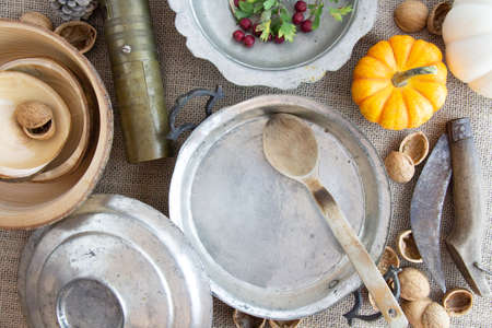 old plate, spoon, retro accessories on the tableの写真素材
