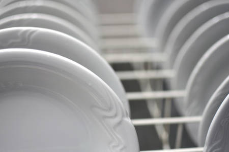 Dishes ready to go in a dishwasher.の写真素材