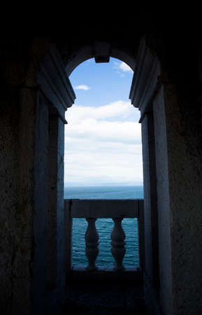 View of an ocean scene through archwayの写真素材
