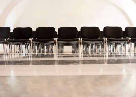 Class room with chairs in a row waiting for a class.の写真素材