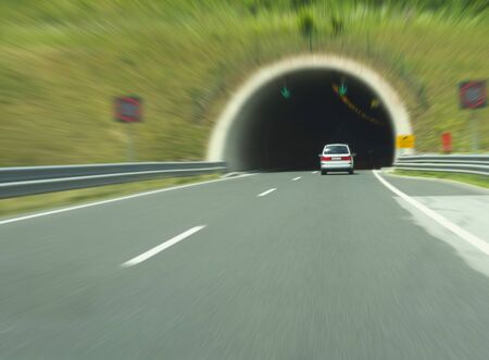 Driving a car into the tunnel.の写真素材