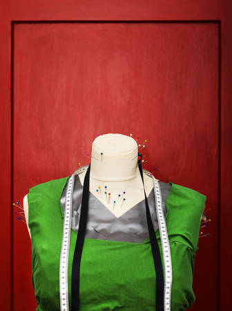 Making a sewing plan with a help of a plastic body.の写真素材