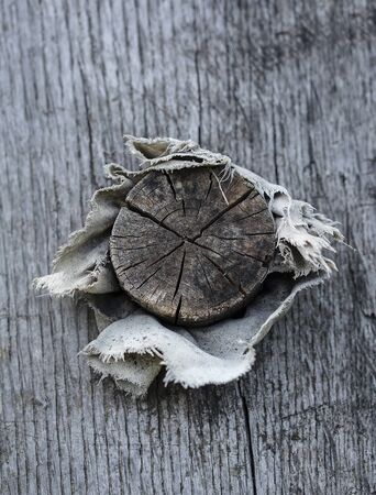 Old fashinoed wooden plug with textile cloth.
