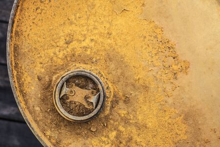 Old metal gasoline container on a wooden floor.の写真素材