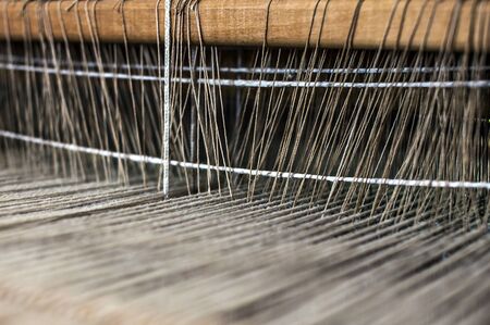 Weaving machine with some fabric.の写真素材