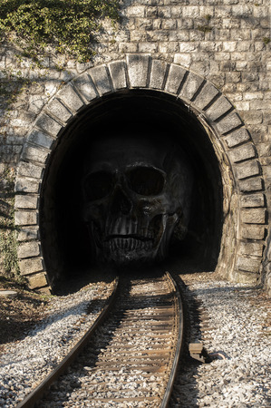 Human skull In the railway tunnel.の写真素材