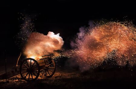 Cannon blast with sparkles flying out.の写真素材