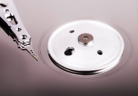 Computer disk close up with a needle.