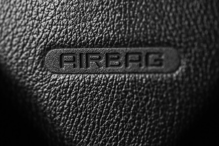 Airbag sign on a car steering wheel.の写真素材