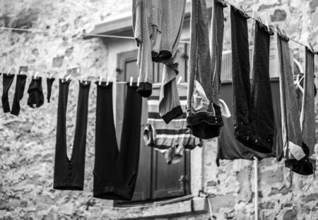 Clothes hanging on ropes and drying on hot air.の写真素材