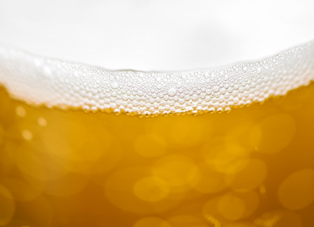 Blured beer background with bubbles.の写真素材