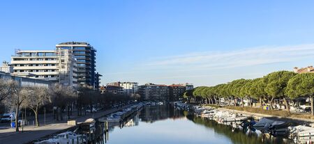 Grado, Italy, EU - January 2, 2019: Small fishing boats parked in a mediterranean sea canal.のeditorial素材