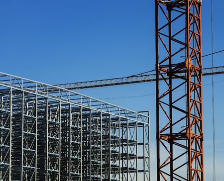 Construction cranes with a metal structure frame being built.の写真素材