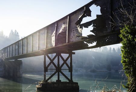 Old train bridge over the river Drava.の写真素材
