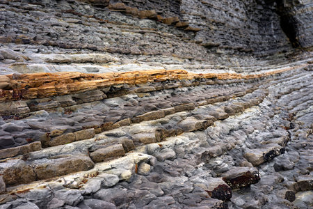 Formation of a stacked layers of rocks exposed over long period of time.