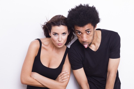 Young interracial couple on white isolated backgroundの写真素材