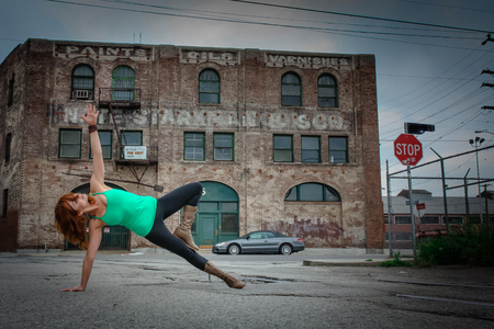 An urban Yogi meditates and practices yoga in the cityの写真素材