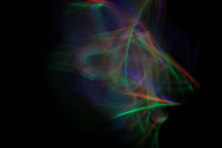 Abstract swirls of light created by a long exposure and light sticksの写真素材