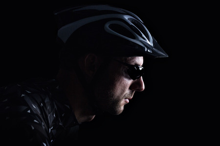 Dark portrait of a cyclistの写真素材