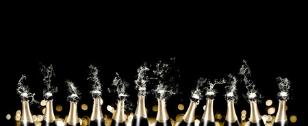 Foaming and splashing champagne bottles panoramaの写真素材