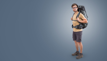 Hiker with a large backpack and short clothingの写真素材