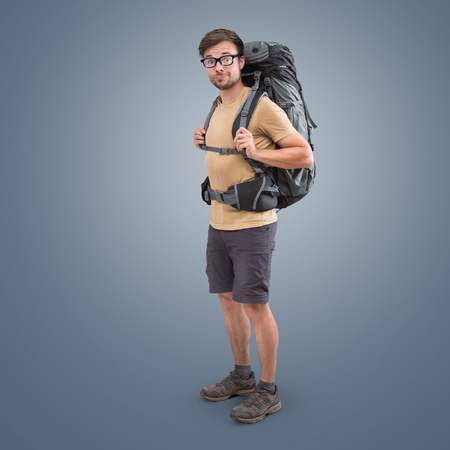 Hiker with a large backpack and short clothingの写真素材