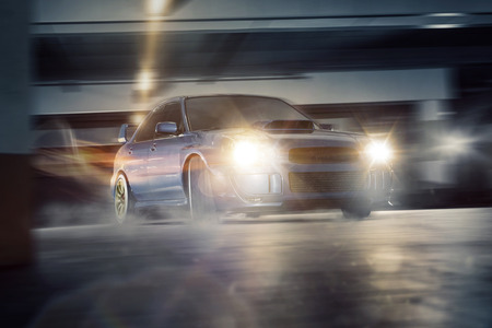 Tuned car drifting in an underground parking lotの写真素材